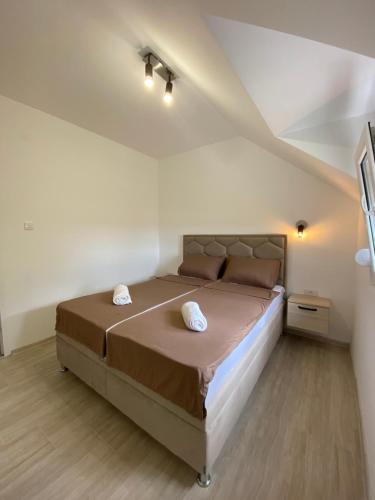 Postel nebo postele na pokoji v ubytování Apartman N&M