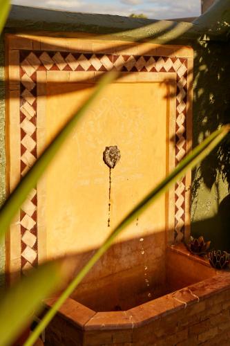 a bird house with a hole in the side of it at Riad Al Ibtikar in Marrakech
