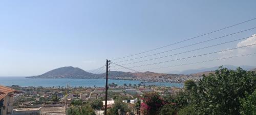 a view of a city and a body of water at Irida Suite in Salamís