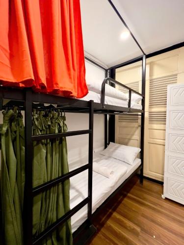 a bunk room with two bunk beds in it at Ding Doong Homes in Hanoi