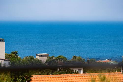 a view of the ocean from a building at OliveRock Apartments - Hladna Uvala in Kruče