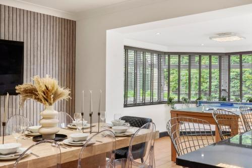 a dining room with a table and chairs at 7 Bed Coastal Villa - Private Heated Pool, Sauna, Parking in Filey