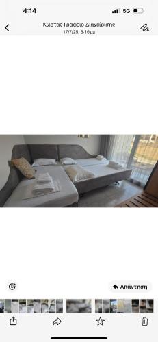 a row of beds in a room with a screenshot at Artion Suites Nikiti in Nikiti