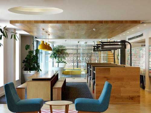 a lobby with chairs and a table in a building at For Students Only - Modern Rooms in York in York