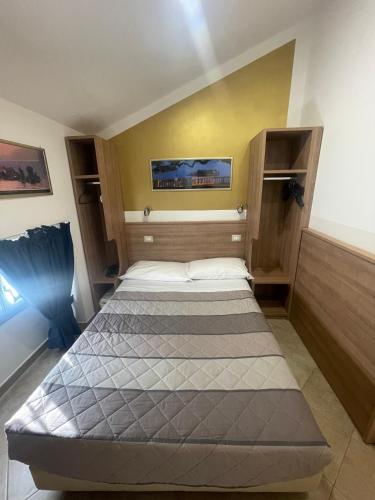 a bedroom with two beds in a room at Hotel Montecarlo in Milan