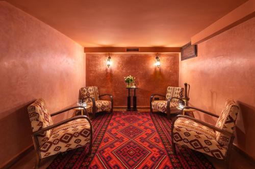 a waiting room with chairs and a red carpet at Alrashid Marrakech Boutique Hotel & SPA in Marrakech