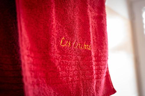 a red tie with the word enamel on it at Duplex terrasse avec belle vue in Fort-de-France