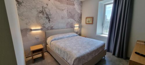 Ένα ή περισσότερα κρεβάτια σε δωμάτιο στο B&B Villa Dina