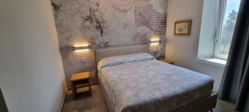 Ένα ή περισσότερα κρεβάτια σε δωμάτιο στο B&B Villa Dina