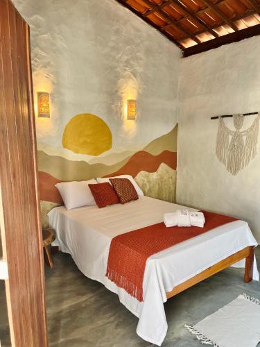 a bedroom with a bed in a room at Zema Bangalôs in Trairi