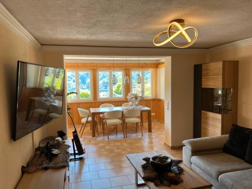 a living room with a couch and a table at Seerhaus 