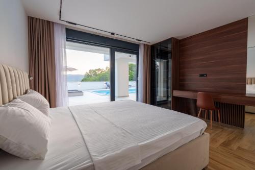 Ένα ή περισσότερα κρεβάτια σε δωμάτιο στο Villa Herzeg