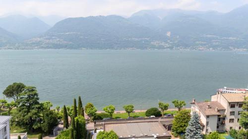 a view of a large body of water with mountains at Colico Polti lake view and pool apartment in Colico