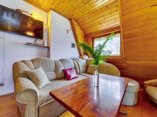 a living room with a couch and a table at Apartment Kotarz View by Interhome in Brenna