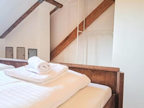 a room with a bed with towels on it at Apartment Kesselboden by Interhome in Grünau im Almtal