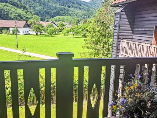 a balcony with a green fence and a yard at Apartment Kesselboden by Interhome in Grünau im Almtal