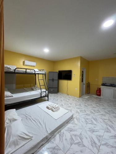 Ένα ή περισσότερα κρεβάτια σε δωμάτιο στο Cabagnow Homestay