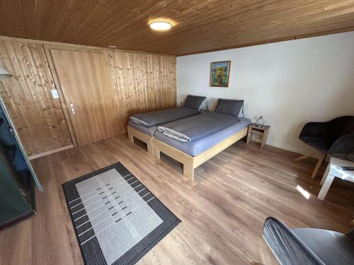 a bedroom with a bed in a room at Apartment Alpenchalet Spiher Parterre by Interhome in Gstaad