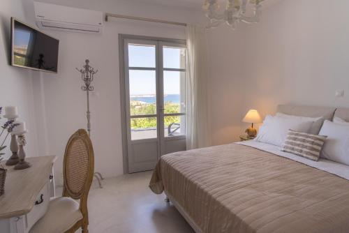 Ένα ή περισσότερα κρεβάτια σε δωμάτιο στο Villas Agia Irini Cove