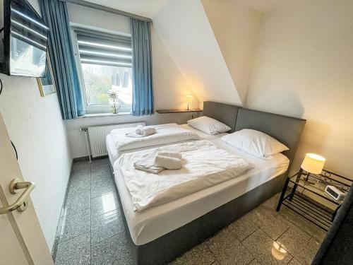 Ένα ή περισσότερα κρεβάτια σε δωμάτιο στο Apartment Fewo 4 in ruhigem Haus by Interhome