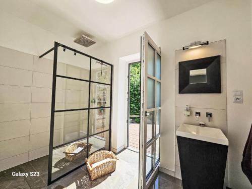 a bathroom with a glass shower and a sink at Holiday Home Casa Lenka by Interhome in Zlaté Hory