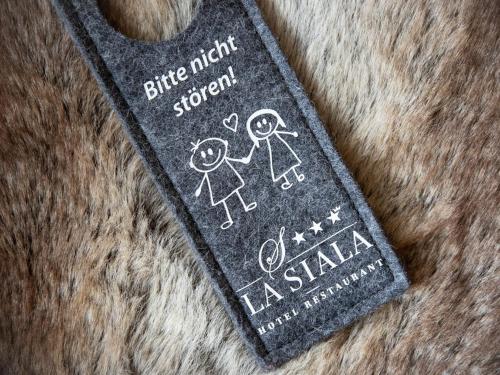 a black object with a stick person on it at Apartment La Siala Apt-56A by Interhome in Falera