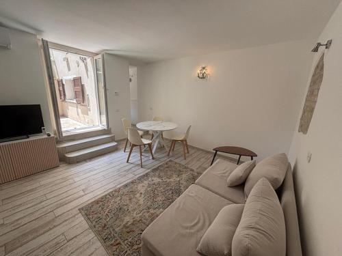 a living room with a couch and a table at Casa Annalisa - Pesaro Center in Pesaro