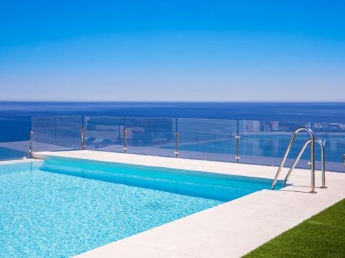 a swimming pool on top of a building at Apartment Collection View Free Spa & Padel by Interhome in Torrox Costa