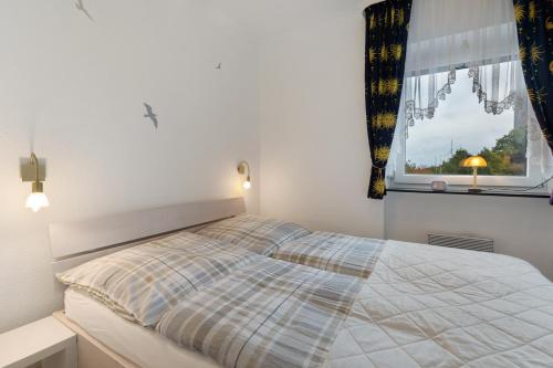Postel nebo postele na pokoji v ubytování Förde-Traumblick 2