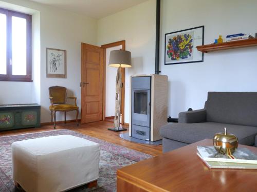 a living room with a couch and a table at Holiday Home La Monda by Interhome in Malvaglia