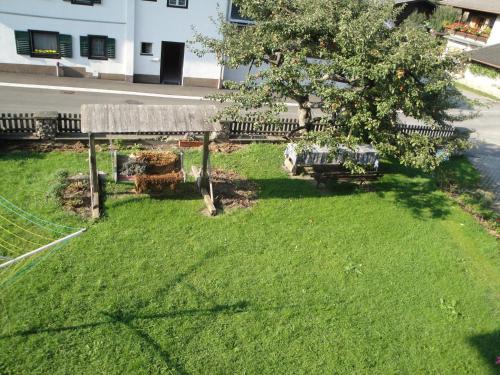 an aerial view of a yard with a tree and benches at Bio Angererhof in Bad Häring