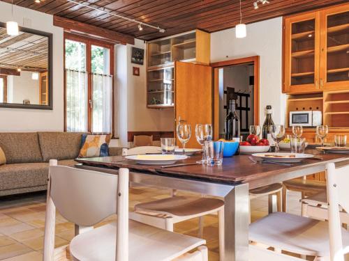 a kitchen and dining room with a table and chairs at Holiday Home Maison des Gorges by Interhome in Moutier