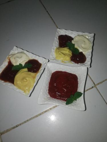three different types of desserts on a white table at Taghia Accommodation in Taghia
