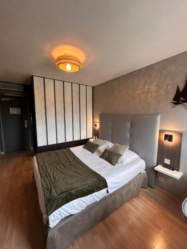Postel nebo postele na pokoji v ubytování Hotel Best Western La Mare Ô Poissons