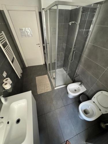 a bathroom with a shower and a toilet and a sink at Homes in Ancona CCA23 Rooms in Ancona