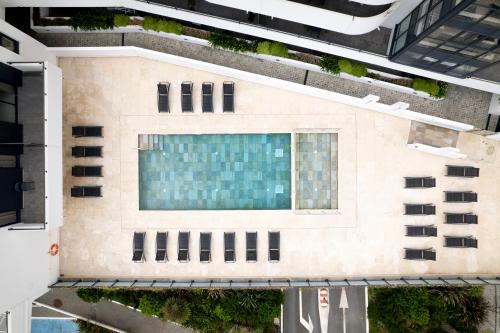 an overhead view of a building with a swimming pool at Nemea Appart Hotel Les Hauts de Milady Biarritz in Biarritz