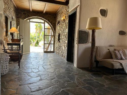 a living room with a couch and a table at Casa Paros in Parikia