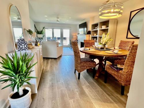 a kitchen and dining room with a table and chairs at 1935 Bohicket Marina in Seabrook Island