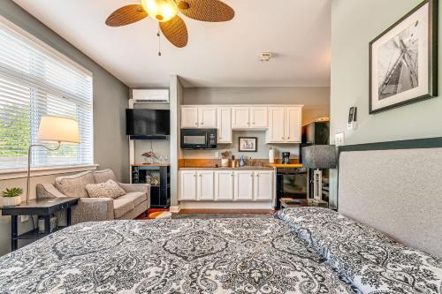 a large bedroom with a bed and a kitchen at Steps to Smith Mountain Lake Unit with Pool Access! in Huddleston
