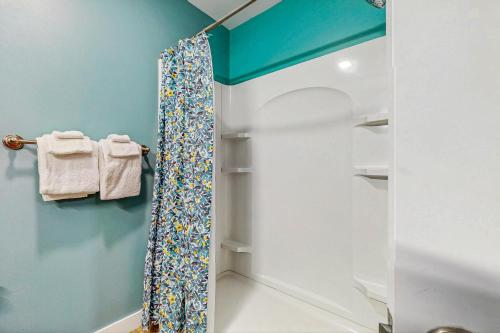 a bathroom with a shower with a shower curtain at Mountainside 75 in Warren