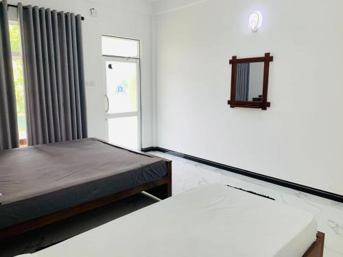 Postel nebo postele na pokoji v ubytování White Shine Hotel