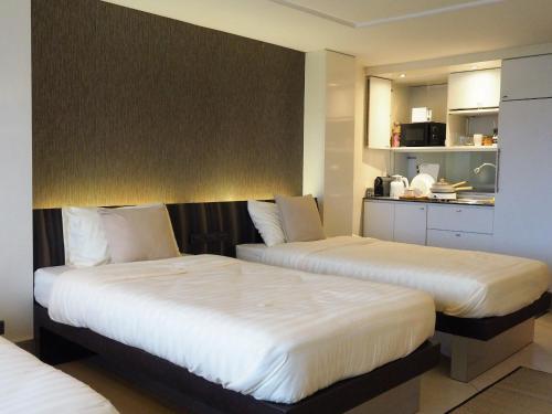 Postel nebo postele na pokoji v ubytování Casa Nimmana City View 3Beds 4Pax - Nimman