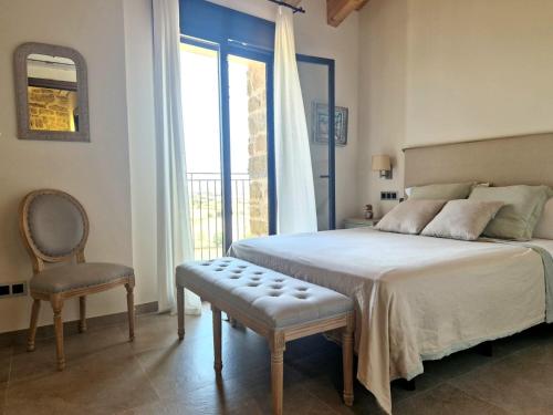 Ένα ή περισσότερα κρεβάτια σε δωμάτιο στο Casa Rural Cal Roseto con jacuzzi