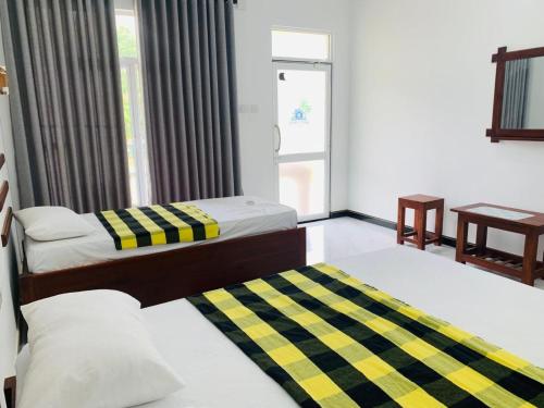 Postel nebo postele na pokoji v ubytování White Shine Hotel