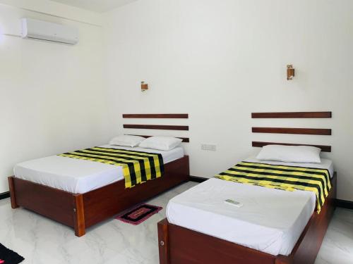 Postel nebo postele na pokoji v ubytování White Shine Hotel