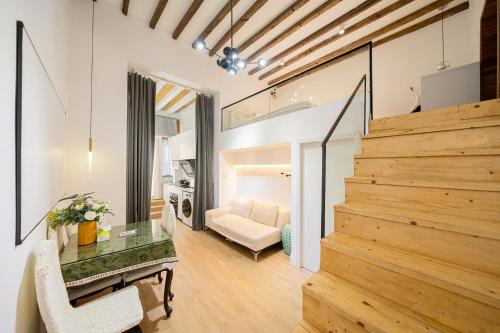 a living room with a staircase leading to a living room at Tonight Homestay West Nanjing Road Shanghai in Shanghai