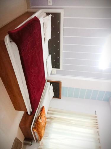 a bed in a room with a window at Ashirwad Guest House in Khātu