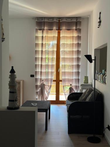a living room with a couch and a window at Guest House Sant'Antonio 