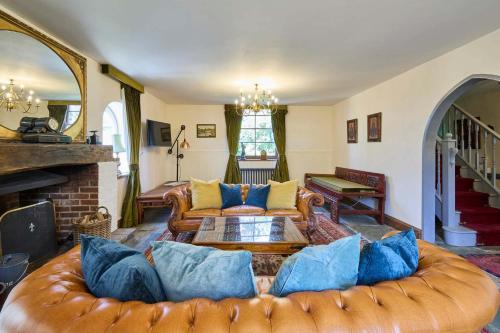a living room with a couch and a fireplace at Host & Stay - The Chapel in East Rudham