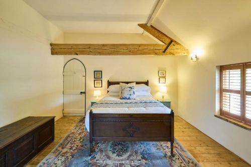 a bedroom with a bed in a room with a window at Host & Stay - The Chapel in East Rudham